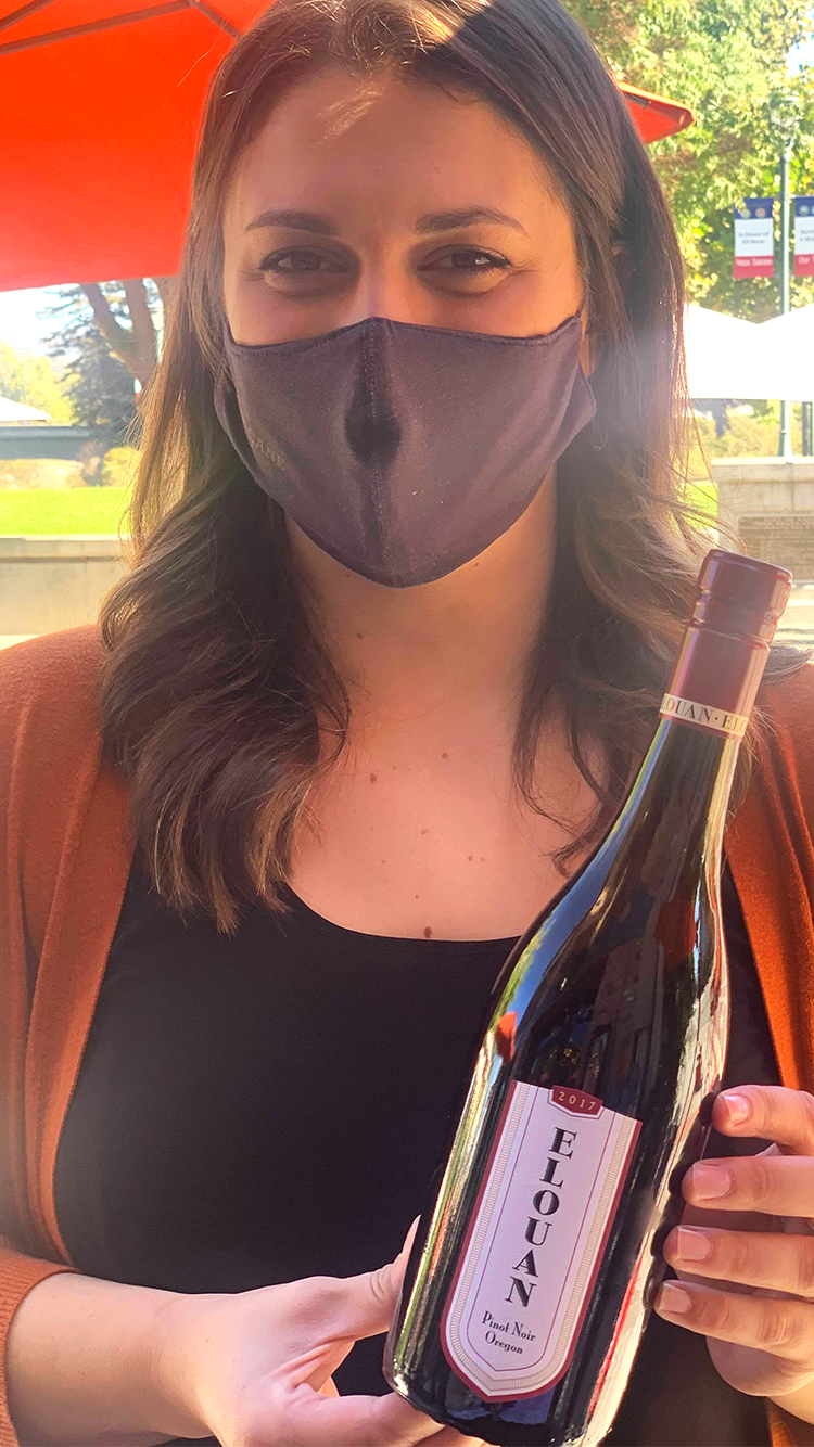 Woman holding a Elouan Pinot Noir Oregon | The Wine Club Philippines